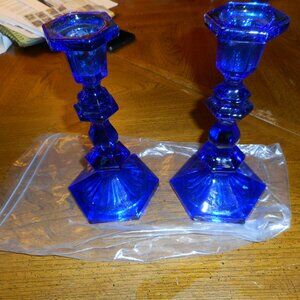 2 matching CANDLESTICK holders  ... cobalt blue in color (looks purple )